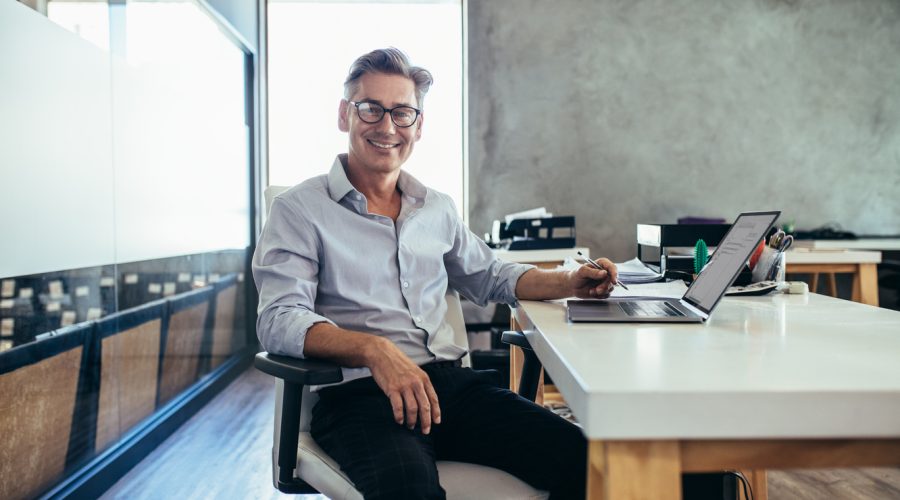 Mid adult businessman at work